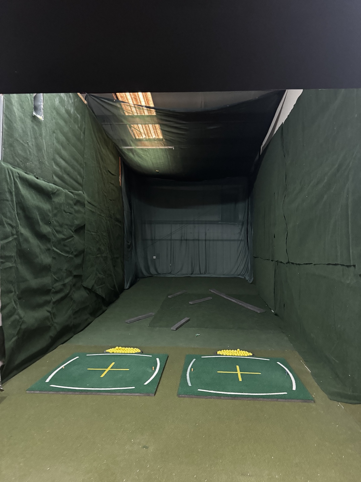 Indoor driving range bay at FIGS